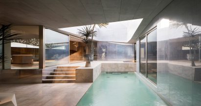 AGi Architects' Rock House features "origami-like" stone facades