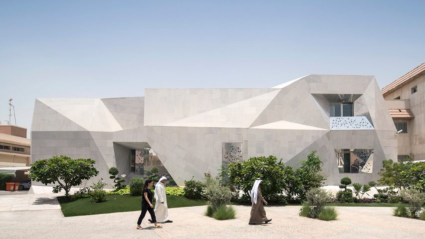 AGi Architects' Rock House features "origami-like" stone facades