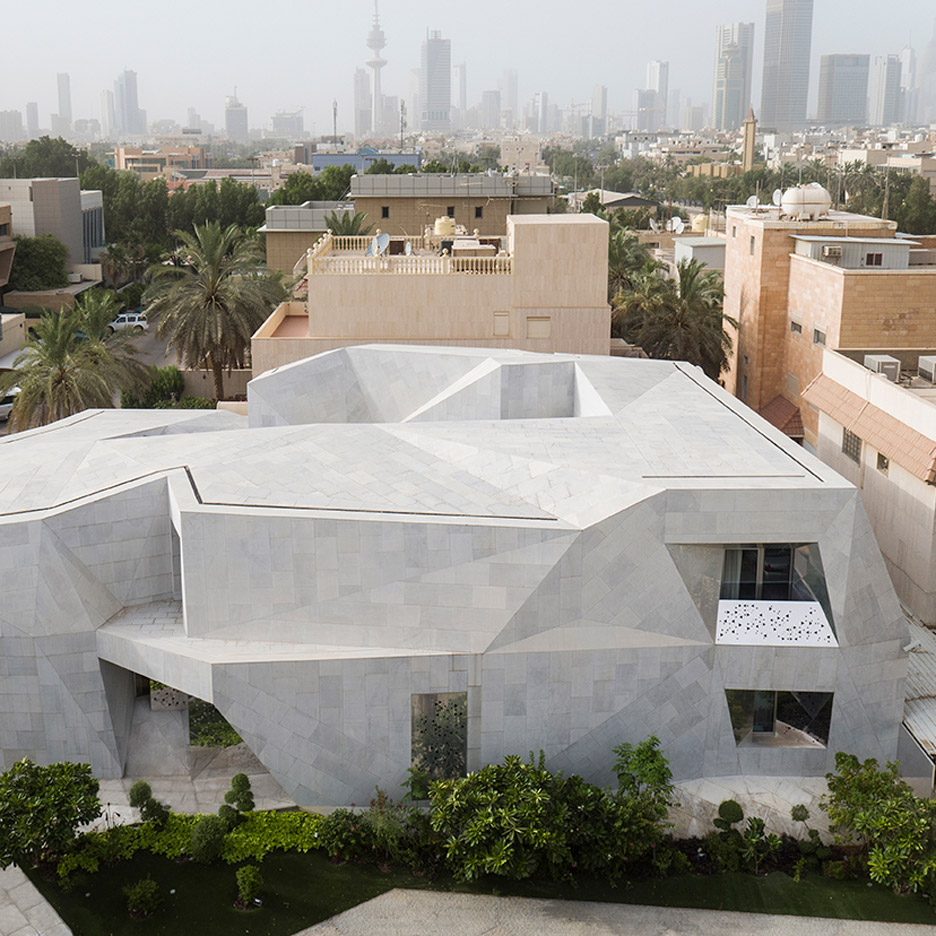 AGi Architects' Rock House features "origami-like" stone facades
