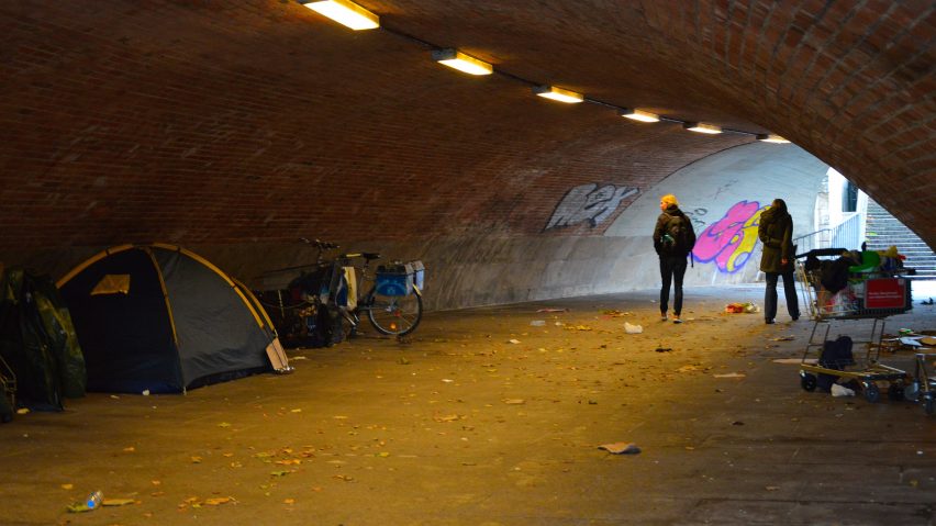 Homeless people camp in an underpass in Berlin