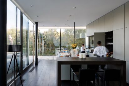 Glass Villa in the lake by Mecanoo in Lechlade, United Kingdom