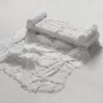 Sofa Pelo sheepskin daybed and table by Guillermo Santomá