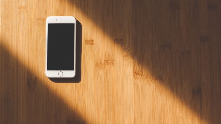 iPhone on a table, photo courtesy of Pixabay