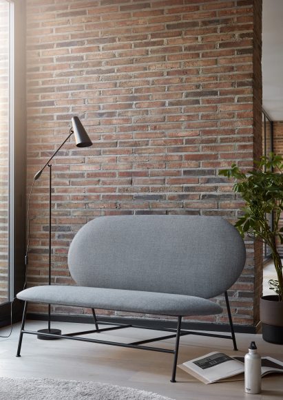 The Oblong two-seater sofa by Chinese designer Mario Tsai comprises a simple metal frame and two oval cushions
