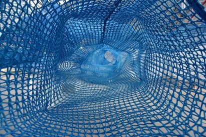 Anya Hindmarch and Numen/For Use create woven network of blue tunnels at London Fashion Week