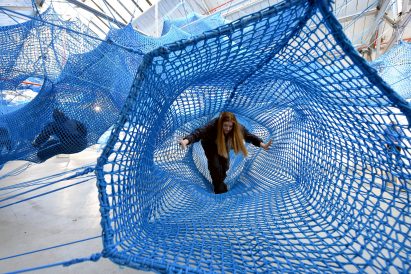 Anya Hindmarch and Numen/For Use create woven network of blue tunnels at London Fashion Week