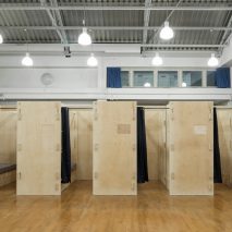 Footage shows construction of temporary sleeping pods for homeless people