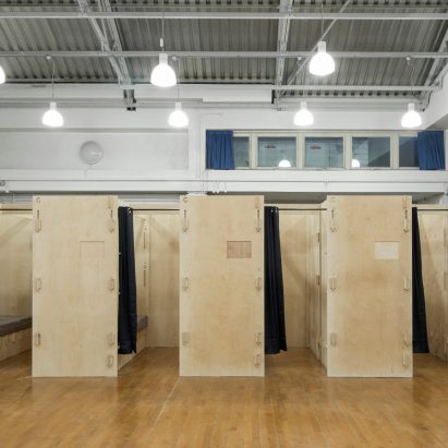 Footage shows construction of temporary sleeping pods for homeless people