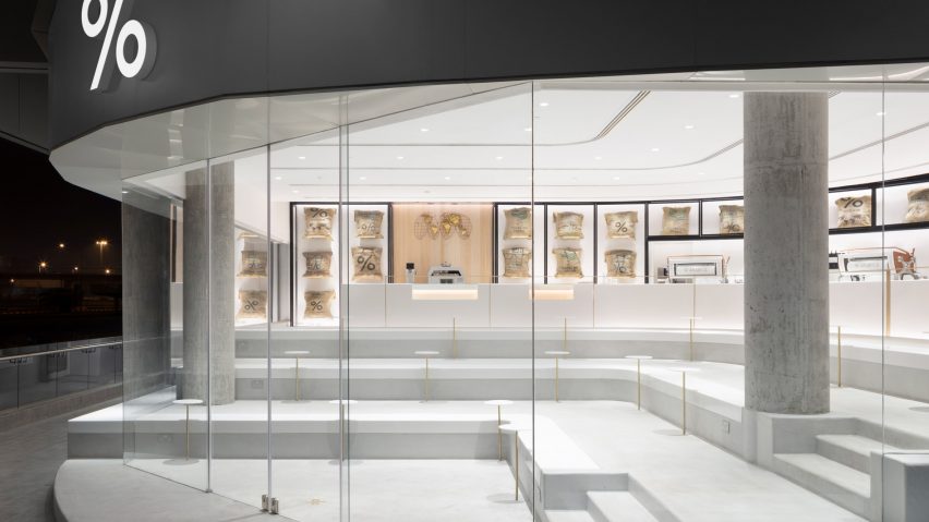 Nendo inserts stepped concrete platforms into Kuwait coffee shop