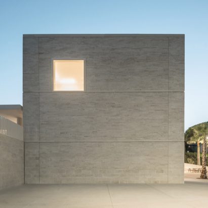 Travertine clads walls of school in Cannes by Atelier Stéphane Fernandez