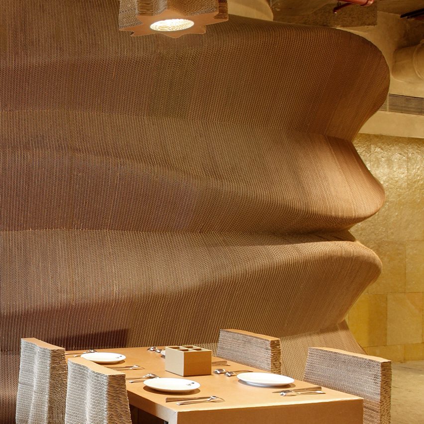 Bombay cafe by Nudes architecture office is made entirely from recycled cardboard