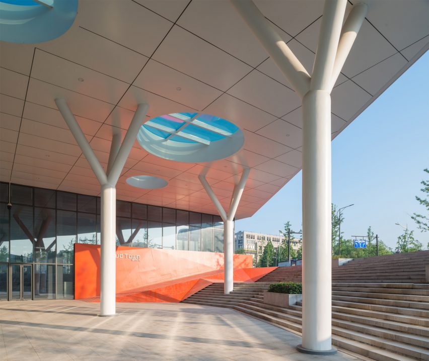 Hangzhou Cloud Town Exhibition Center by Approach Design has a green roof with a running track