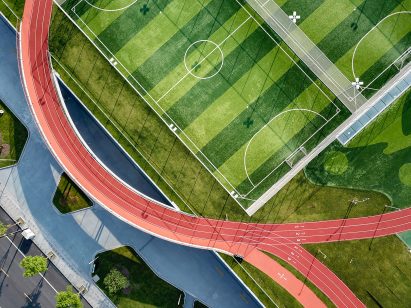 Hangzhou Cloud Town Exhibition Center by Approach Design has a green roof with a running track