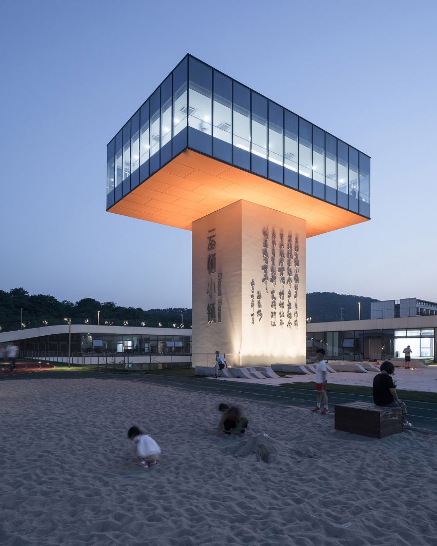 Hangzhou Cloud Town Exhibition Center by Approach Design has a green roof with a running track