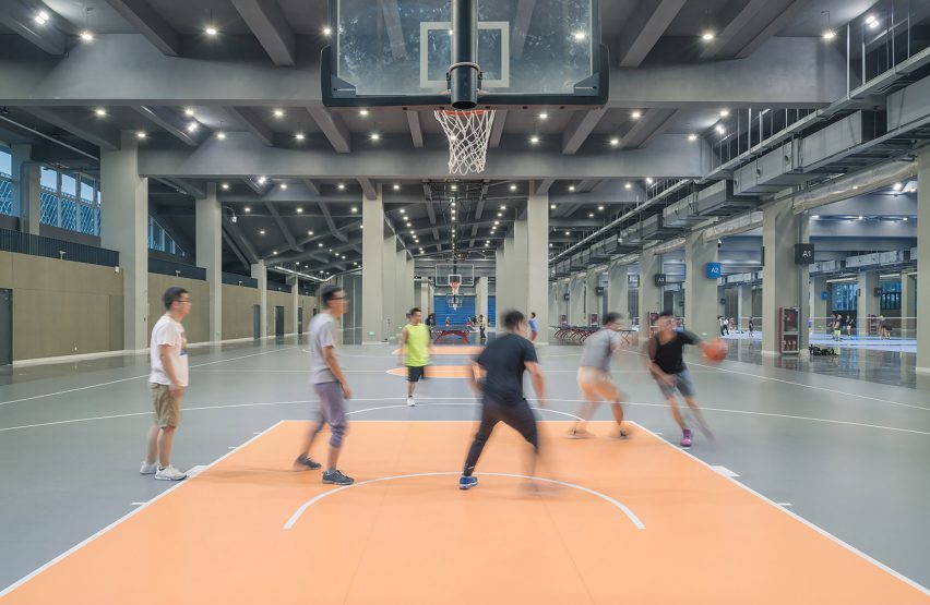 Hangzhou Cloud Town Exhibition Center by Approach Design has a green roof with a running track