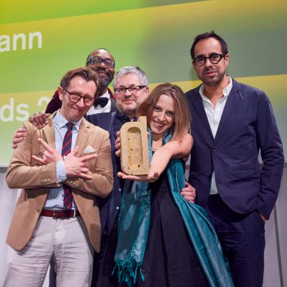 "Winning has opened doors to another level of business" say Dezeen Awards 2018 winners. Pictured Casson Mann accepting accepting a Dezeen Award for interior design project of the year
