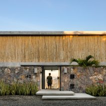 Bamboo screen fronts minimal home on Mexico’s west coast by Zozaya Arquitectos