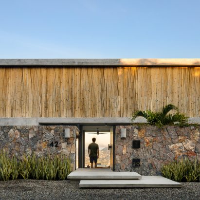 Bamboo screen fronts minimal home on Mexico’s west coast by Zozaya Arquitectos