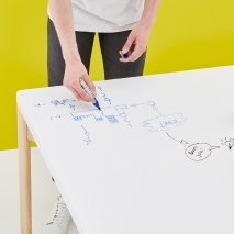 Moving Walls’ latest office table doubles up as a wall-hung whiteboard