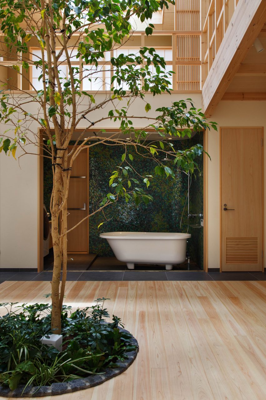 07Beach arrange Kyoto home around glass-fronted bathroom