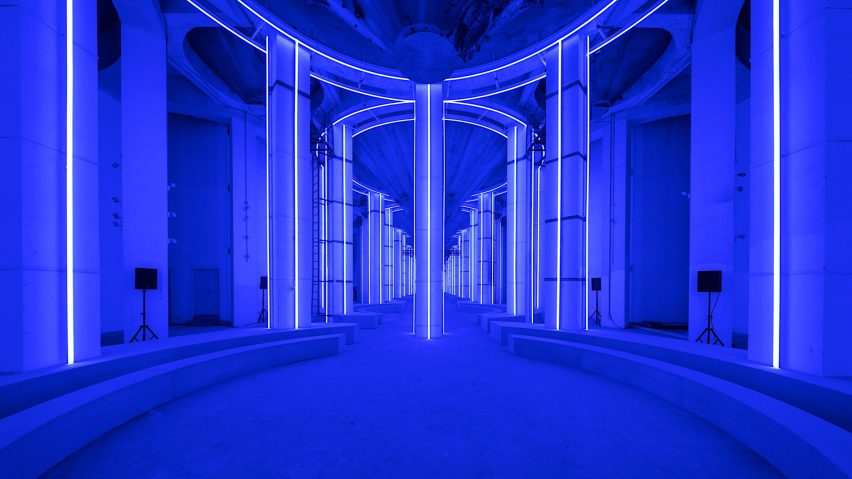 AMO creates blue-lit runway in Shanghai’s Silo Hall for Prada menswear show
