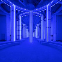 AMO creates blue-lit runway in Shanghai’s Silo Hall for Prada menswear show