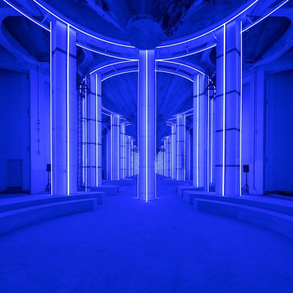 AMO creates blue-lit runway in Shanghai’s Silo Hall for Prada menswear show