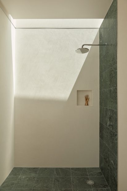 An exposed concrete frame supports this 4.2-metre-wide skinny house in Melbourne designed by Oliver du Puy Architects to feature meditation spaces.