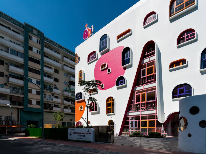 TTC Elite Saigon Kindergarten in by Kientruc O in has a distinctive facade decorated with colourful patches and irregularly shaped windows.