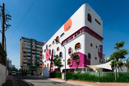 TTC Elite Saigon Kindergarten in by Kientruc O in has a distinctive facade decorated with colourful patches and irregularly shaped windows.