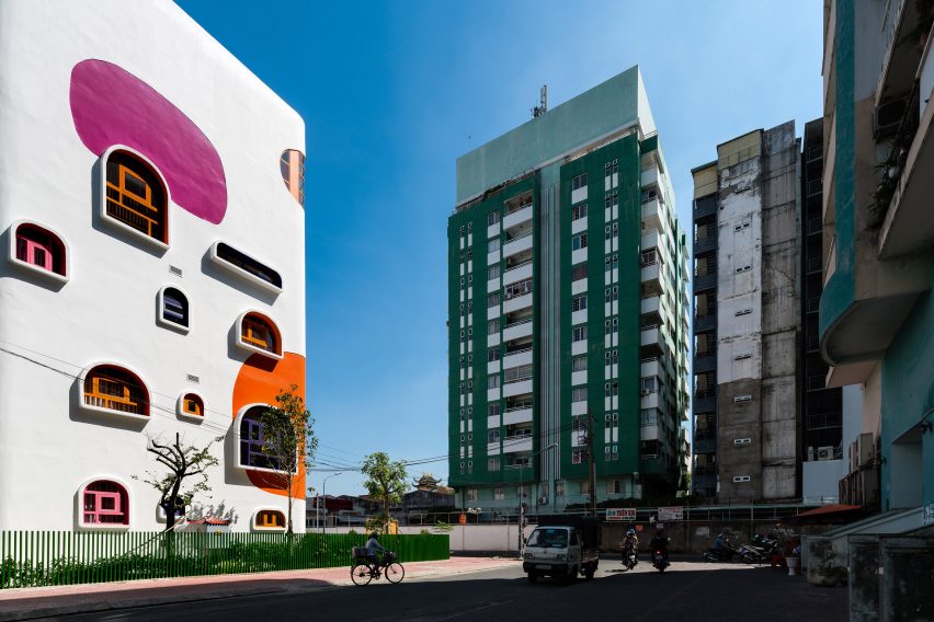 TTC Elite Saigon Kindergarten in by Kientruc O in has a distinctive facade decorated with colourful patches and irregularly shaped windows.