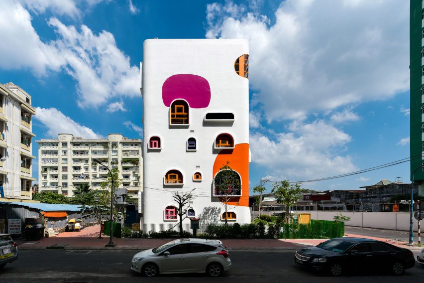 TTC Elite Saigon Kindergarten in by Kientruc O in has a distinctive facade decorated with colourful patches and irregularly shaped windows.