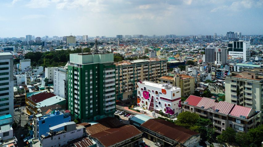 TTC Elite Saigon Kindergarten in by Kientruc O in has a distinctive facade decorated with colourful patches and irregularly shaped windows.