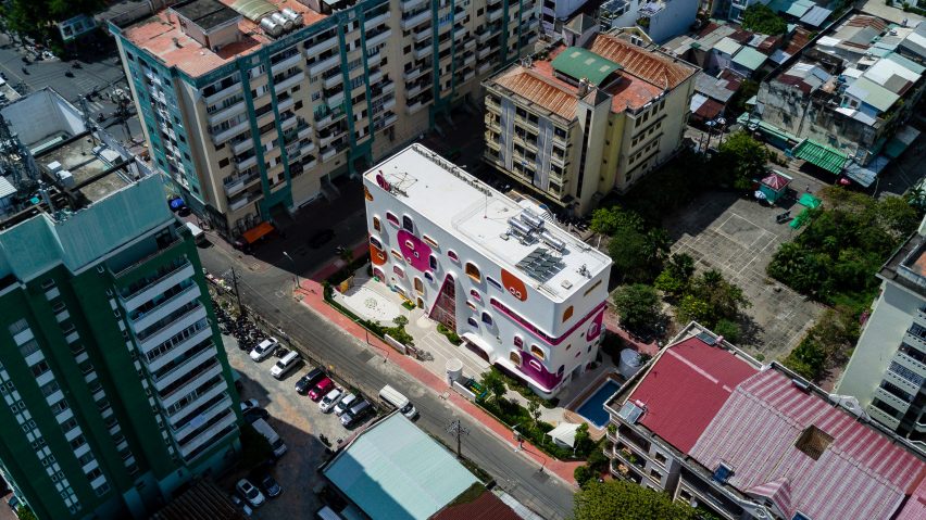 TTC Elite Saigon Kindergarten in by Kientruc O in has a distinctive facade decorated with colourful patches and irregularly shaped windows.
