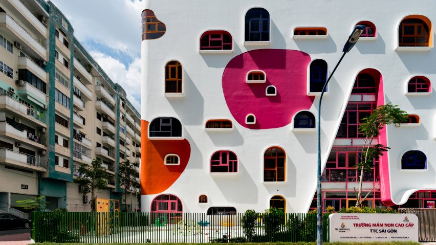 TTC Elite Saigon Kindergarten in by Kientruc O in has a distinctive facade decorated with colourful patches and irregularly shaped windows.