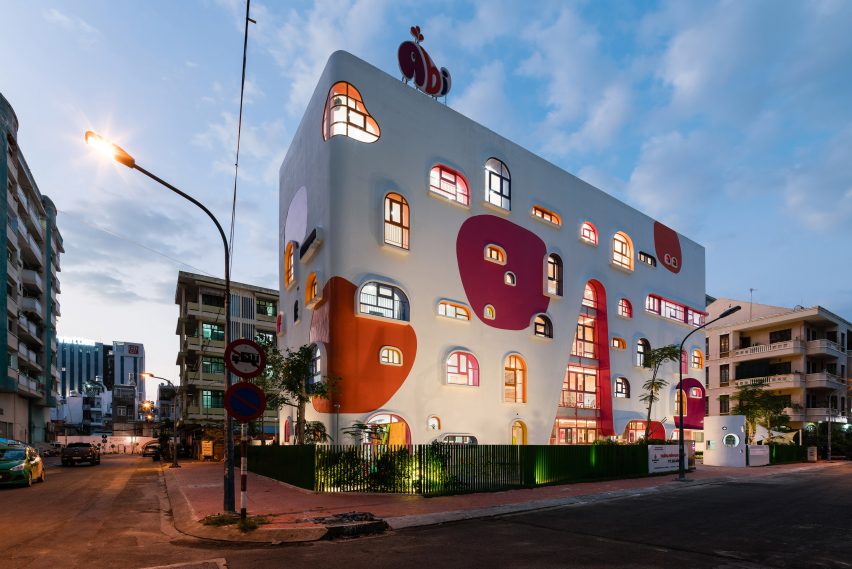 TTC Elite Saigon Kindergarten in by Kientruc O in has a distinctive facade decorated with colourful patches and irregularly shaped windows.