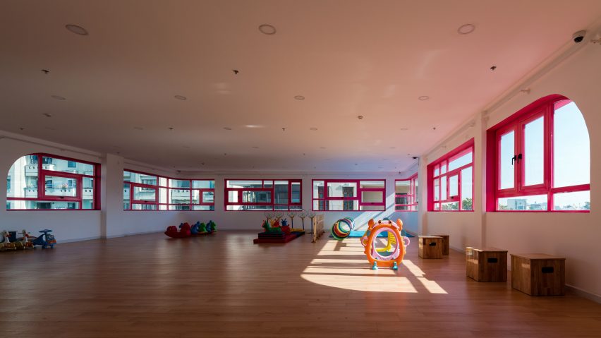 TTC Elite Saigon Kindergarten in by Kientruc O in has a distinctive facade decorated with colourful patches and irregularly shaped windows.