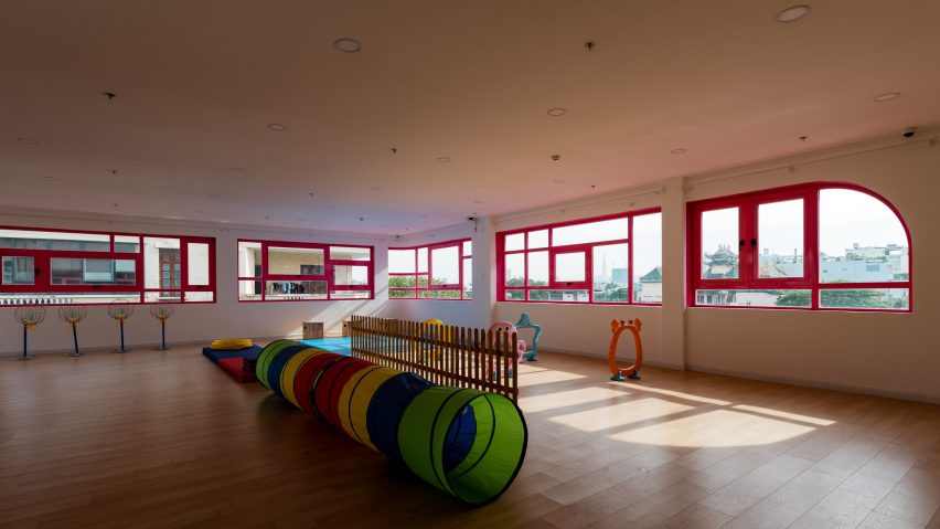 TTC Elite Saigon Kindergarten in by Kientruc O in has a distinctive facade decorated with colourful patches and irregularly shaped windows.