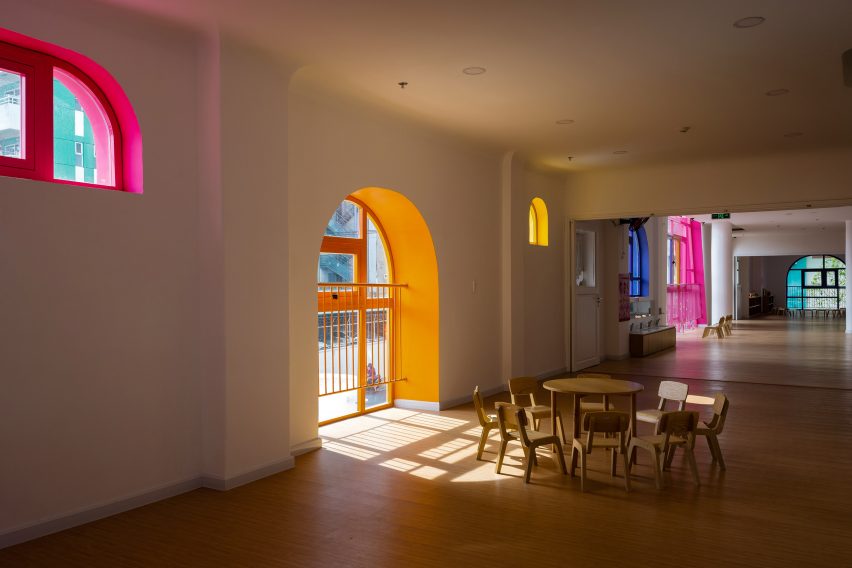 TTC Elite Saigon Kindergarten in by Kientruc O in has a distinctive facade decorated with colourful patches and irregularly shaped windows.