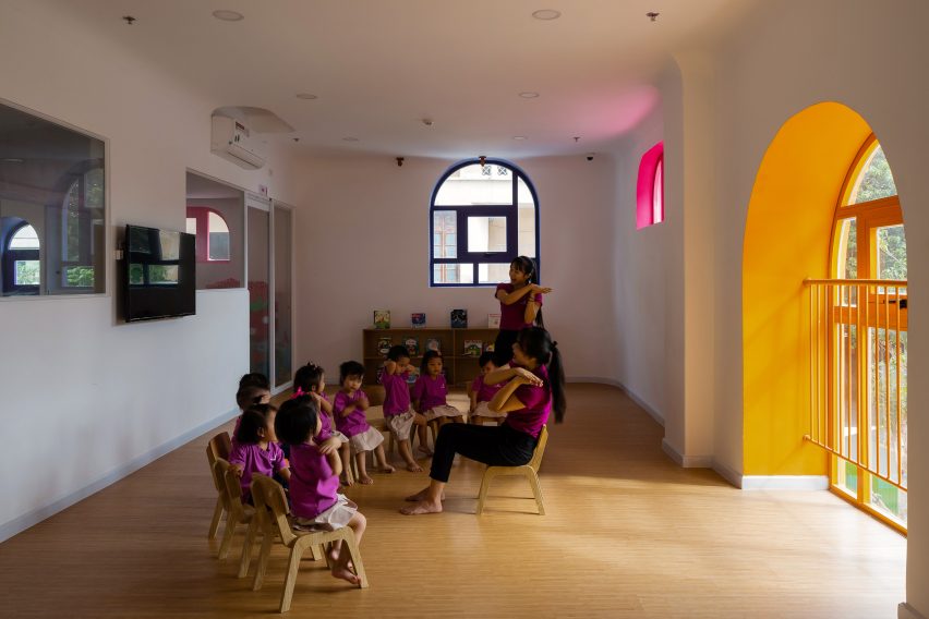 TTC Elite Saigon Kindergarten in by Kientruc O in has a distinctive facade decorated with colourful patches and irregularly shaped windows.