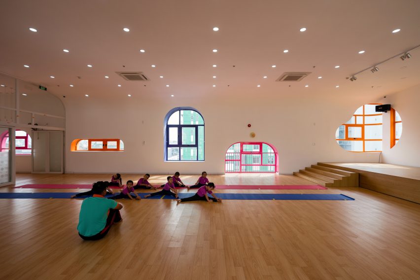 TTC Elite Saigon Kindergarten in by Kientruc O in has a distinctive facade decorated with colourful patches and irregularly shaped windows.