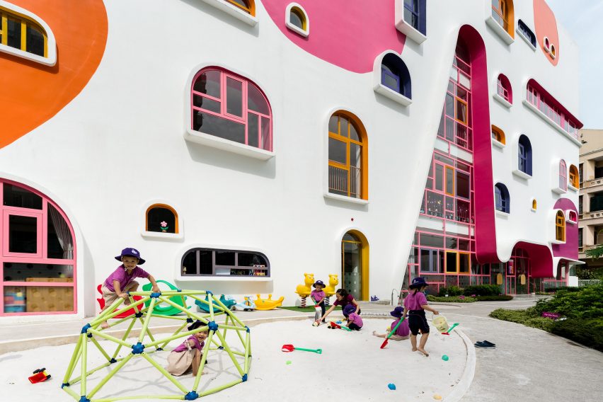 TTC Elite Saigon Kindergarten in by Kientruc O in has a distinctive facade decorated with colourful patches and irregularly shaped windows.
