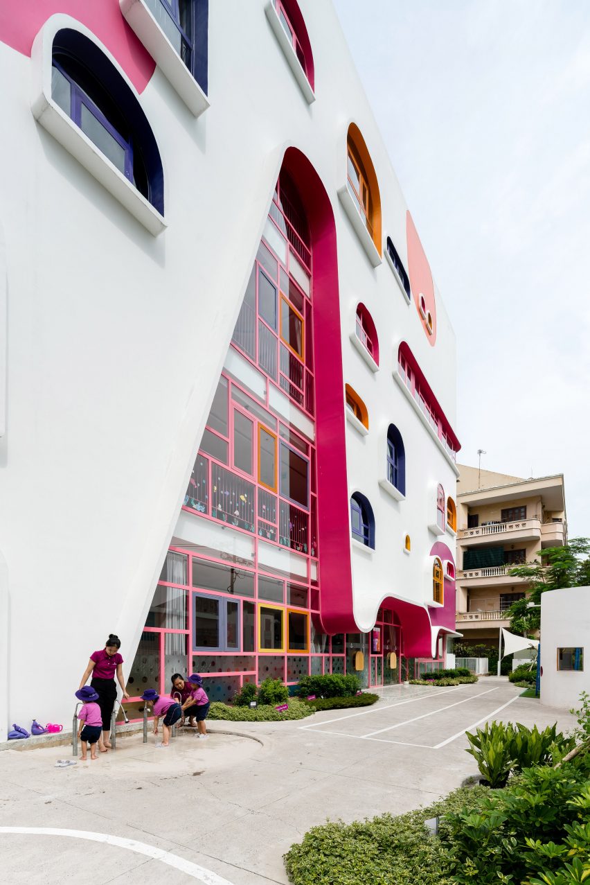 TTC Elite Saigon Kindergarten in by Kientruc O in has a distinctive facade decorated with colourful patches and irregularly shaped windows.