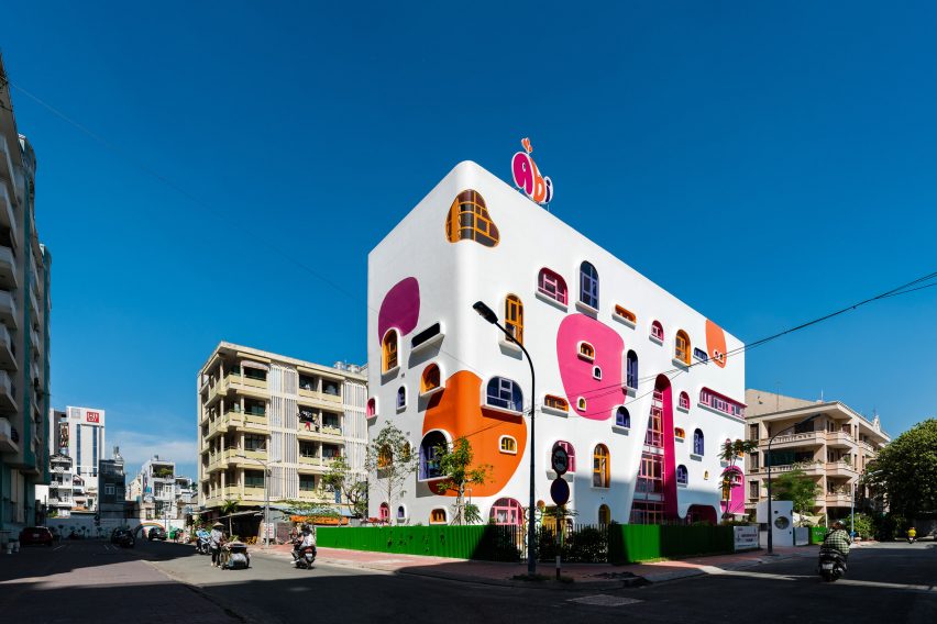 TTC Elite Saigon Kindergarten in by Kientruc O in has a distinctive facade decorated with colourful patches and irregularly shaped windows.