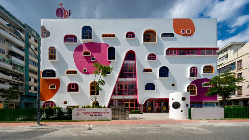 TTC Elite Saigon Kindergarten in by Kientruc O in has a distinctive facade decorated with colourful patches and irregularly shaped windows.