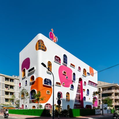 TTC Elite Saigon Kindergarten in by Kientruc O in has a distinctive facade decorated with colourful patches and irregularly shaped windows.