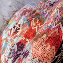 Manju Devi's abstract Aas Pass rug is inspired by rural village life