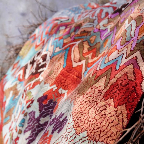 Manju Devi's abstract Aas Pass rug is inspired by rural village life