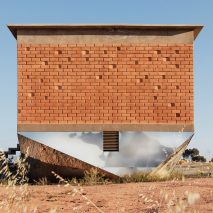 Mirrored bottoms reflect desert site beneath Mexican inn by Santos Bolivar Architects 