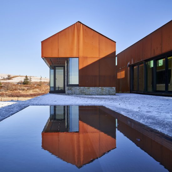 Smith Residence by MacKay-Lyons Sweetapple is a "village" of gabled steel structures